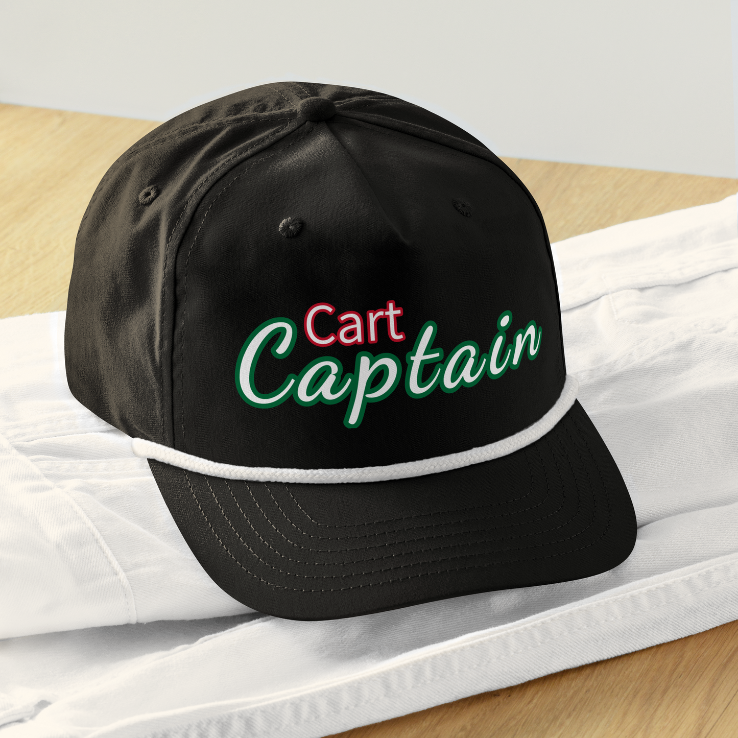 Black cap with 'Cart Captain' text on a white surface